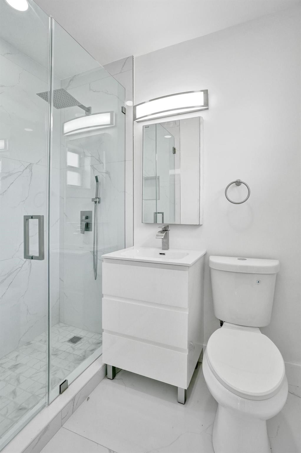 7341 Meridian Street Miramar, FL 33023 - Photo 10 of 74 a bathroom with a sink a toilet and shower