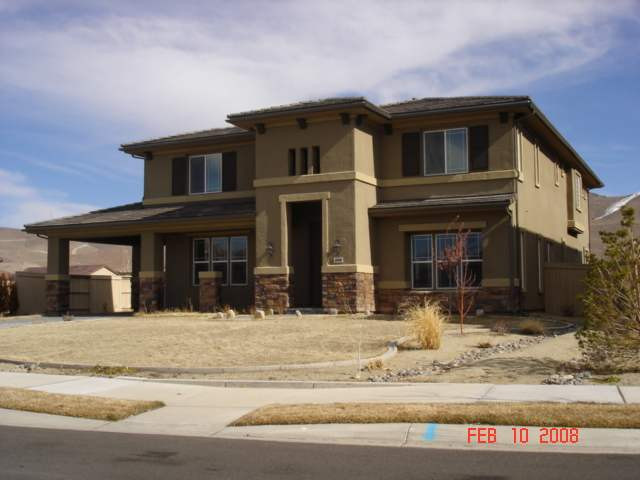 10000 Burghley Lane Reno, NV 89521 - Photo 1 of 9 a view of a house with snow on the background