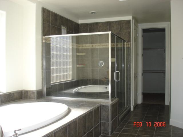 10000 Burghley Lane Reno, NV 89521 - Photo 6 of 9 a bathroom with a tub and a sink