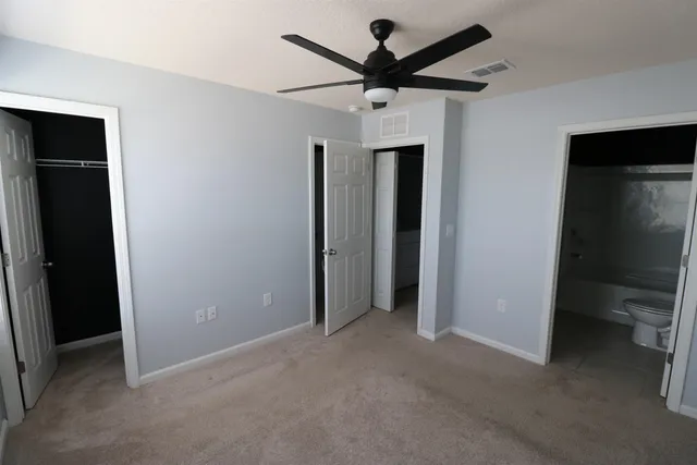 a view of a livingroom with a ceiling fan