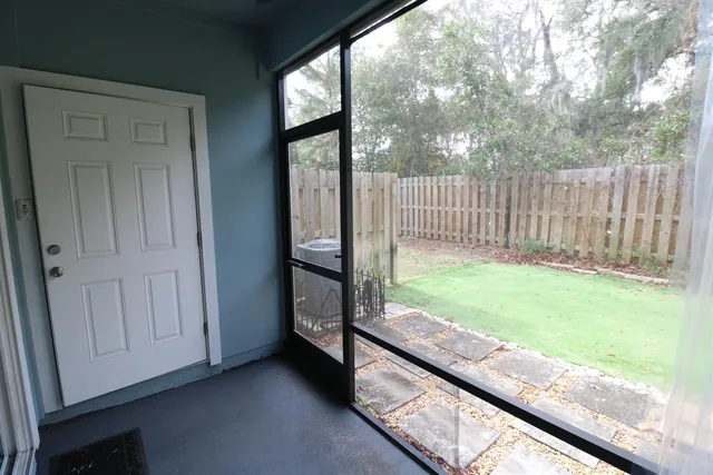 a view of backyard with porch and garden