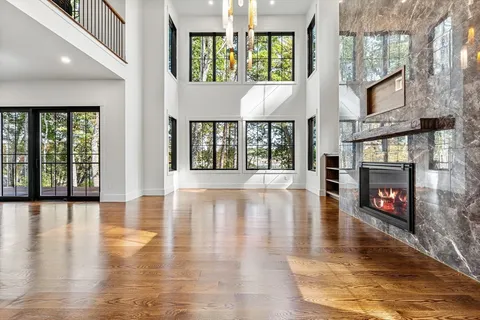 an entryway with fireplace and windows