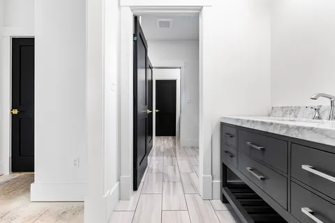 a bathroom with a sink and a mirror