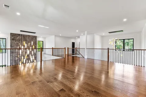 a view of a an entryway with wooden floor
