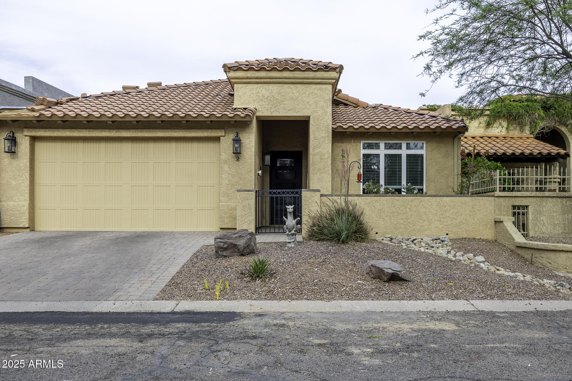 943 East Kortsen Road, Unit 2 Casa Grande, AZ 85122 - Photo 1 of 43 a front view of a house with a yard and garage