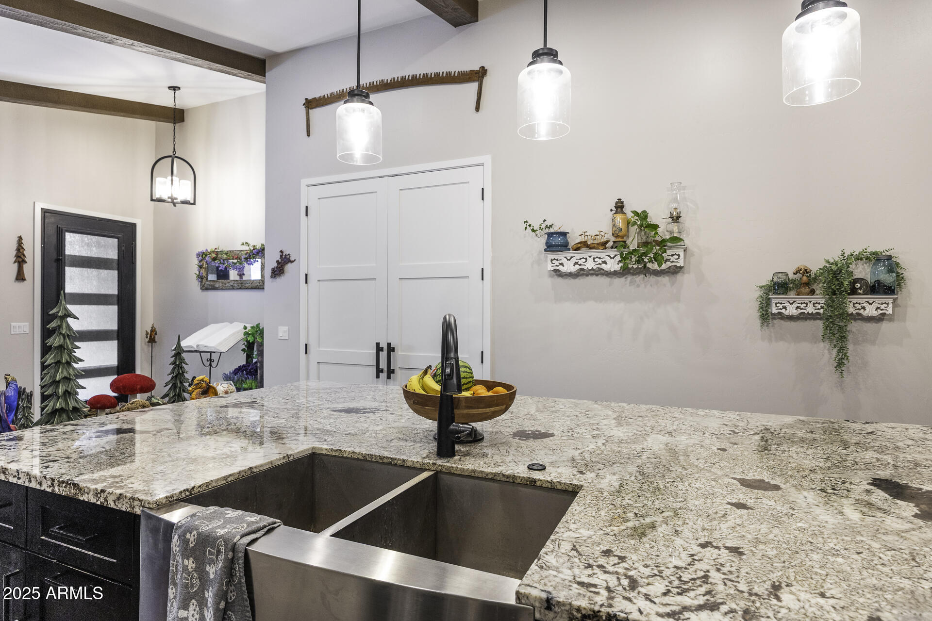 943 East Kortsen Road, Unit 2 Casa Grande, AZ 85122 - Photo 12 of 43 a kitchen view with granite countertop a sink stainless steel appliances and cabinets