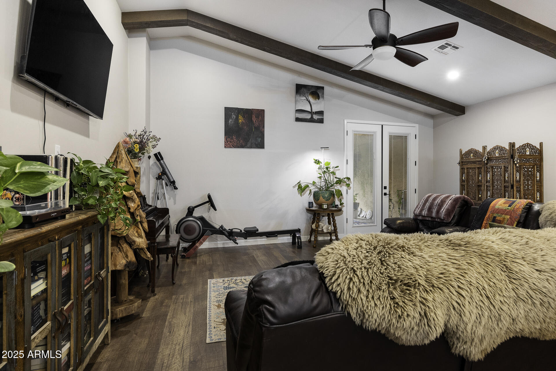943 East Kortsen Road, Unit 2 Casa Grande, AZ 85122 - Photo 17 of 43 a bed room with a bed window and a flat screen tv