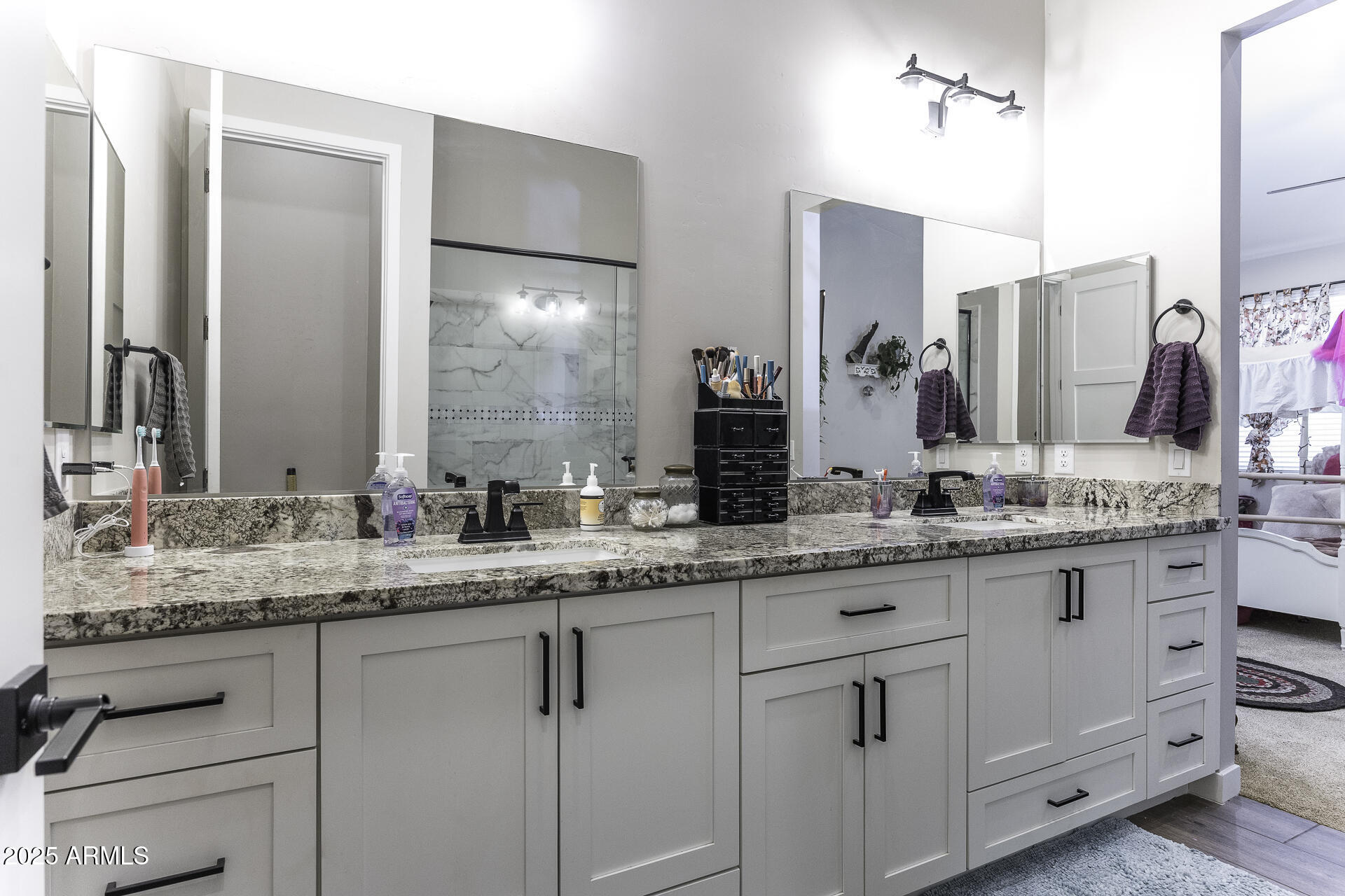 943 East Kortsen Road, Unit 2 Casa Grande, AZ 85122 - Photo 25 of 43 a bathroom with a granite countertop sink and a mirror
