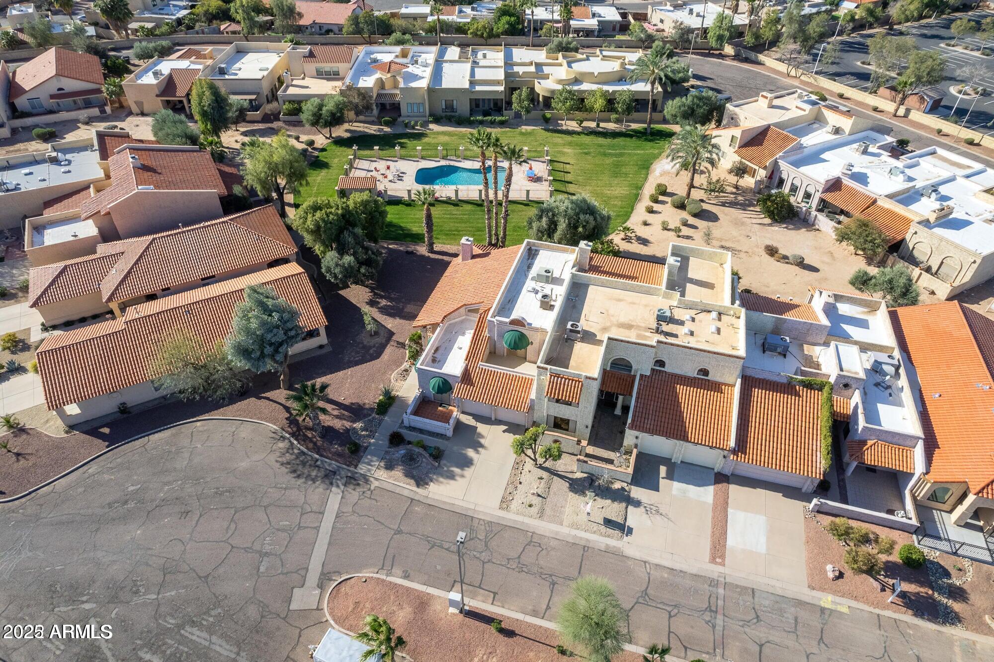 943 East Kortsen Road, Unit 2 Casa Grande, AZ 85122 - Photo 38 of 43 an aerial view of a house with a swimming pool yard and outdoor seating