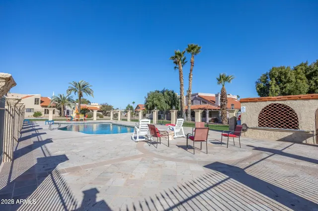 a view of a swimming pool with a lounge chair