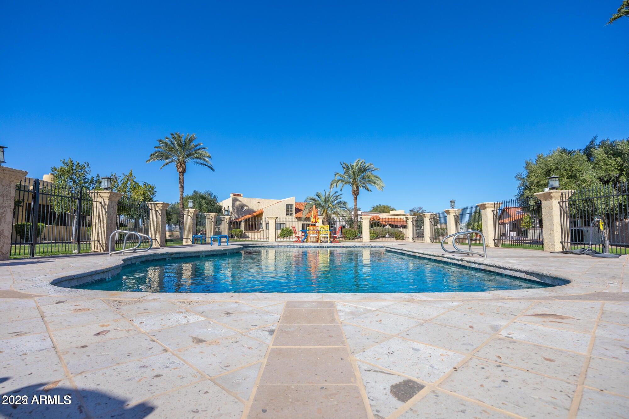 943 East Kortsen Road, Unit 2 Casa Grande, AZ 85122 - Photo 40 of 43 a view of a swimming pool with a lounge chair