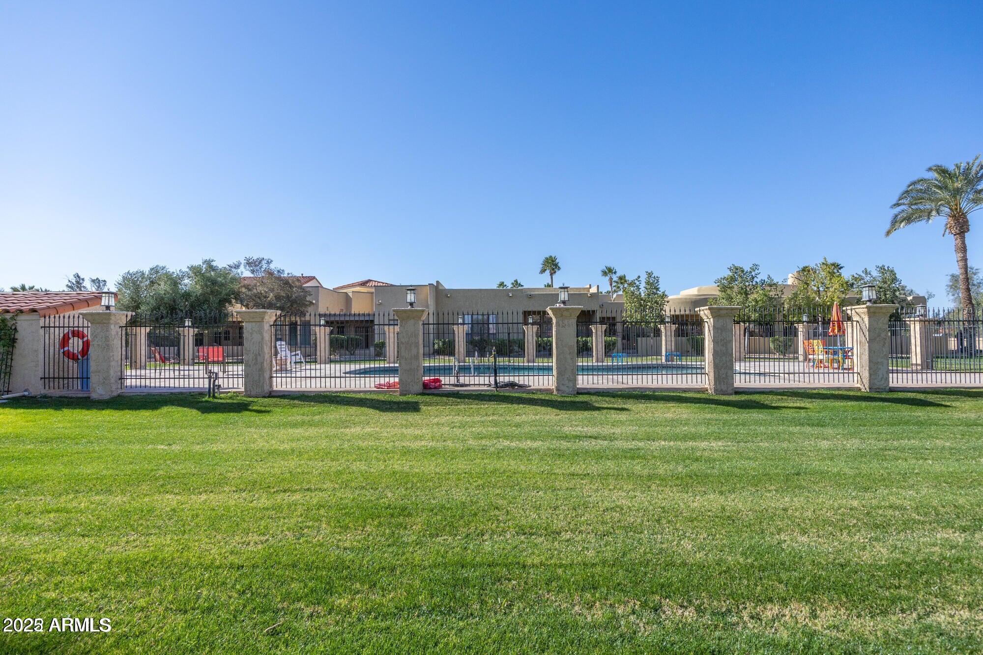 943 East Kortsen Road, Unit 2 Casa Grande, AZ 85122 - Photo 43 of 43 a swimming pool with outdoor seating and yard