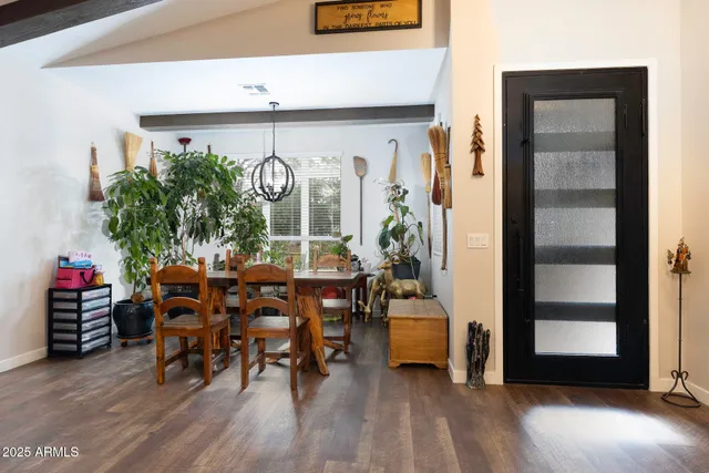 a living room filled with furniture and wooden floor