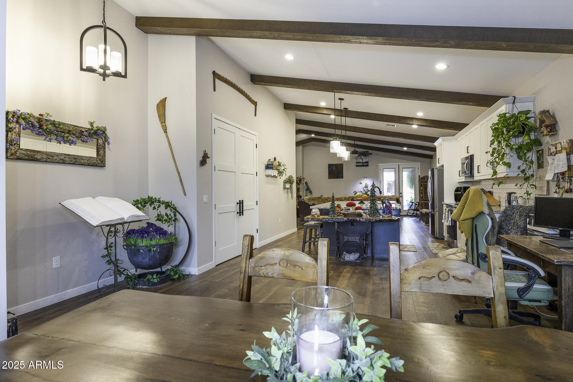 943 East Kortsen Road, Unit 2 Casa Grande, AZ 85122 - Photo 8 of 43 a living room filled with furniture and a chandelier