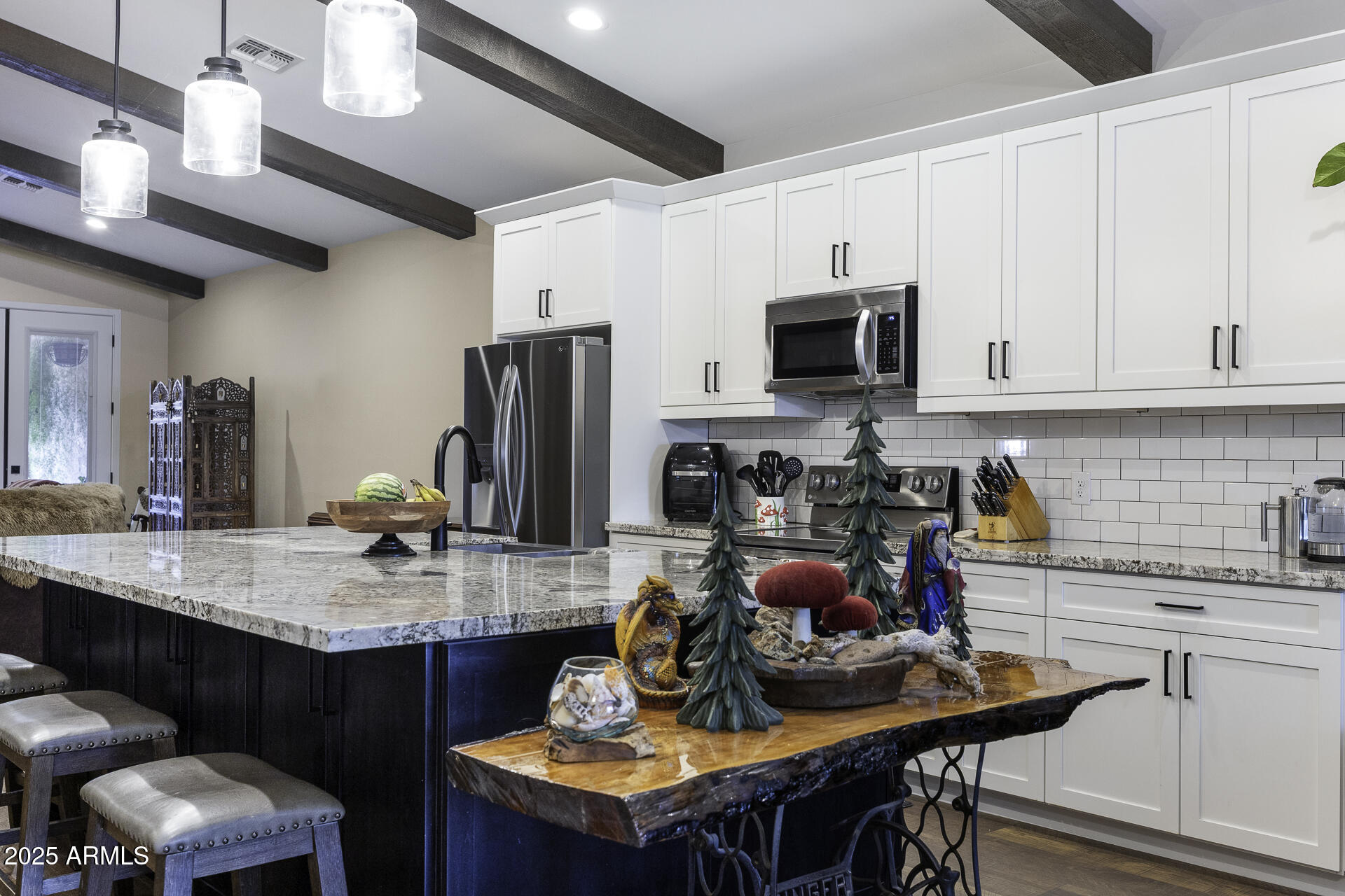 943 East Kortsen Road, Unit 2 Casa Grande, AZ 85122 - Photo 9 of 43 a kitchen with a dining table and chairs