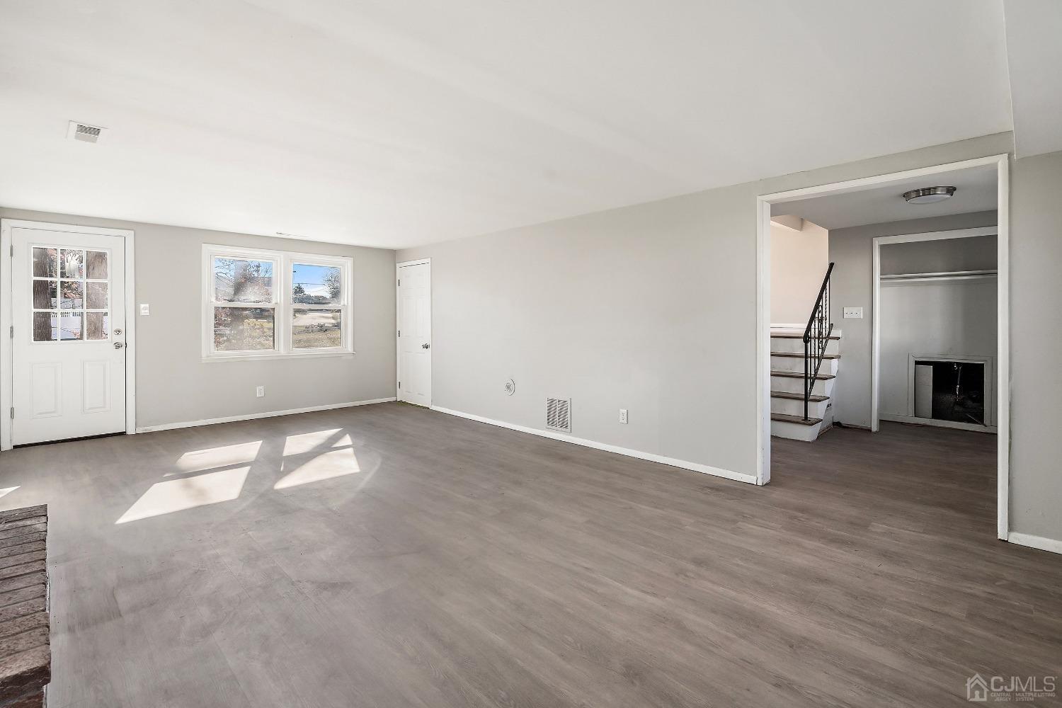 11 Hill Road Edison, NJ 08817 - Photo 6 of 24 an empty room with windows and entrance