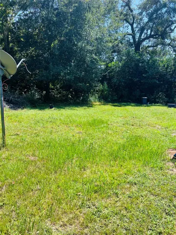 a view of a yard with an outdoor space
