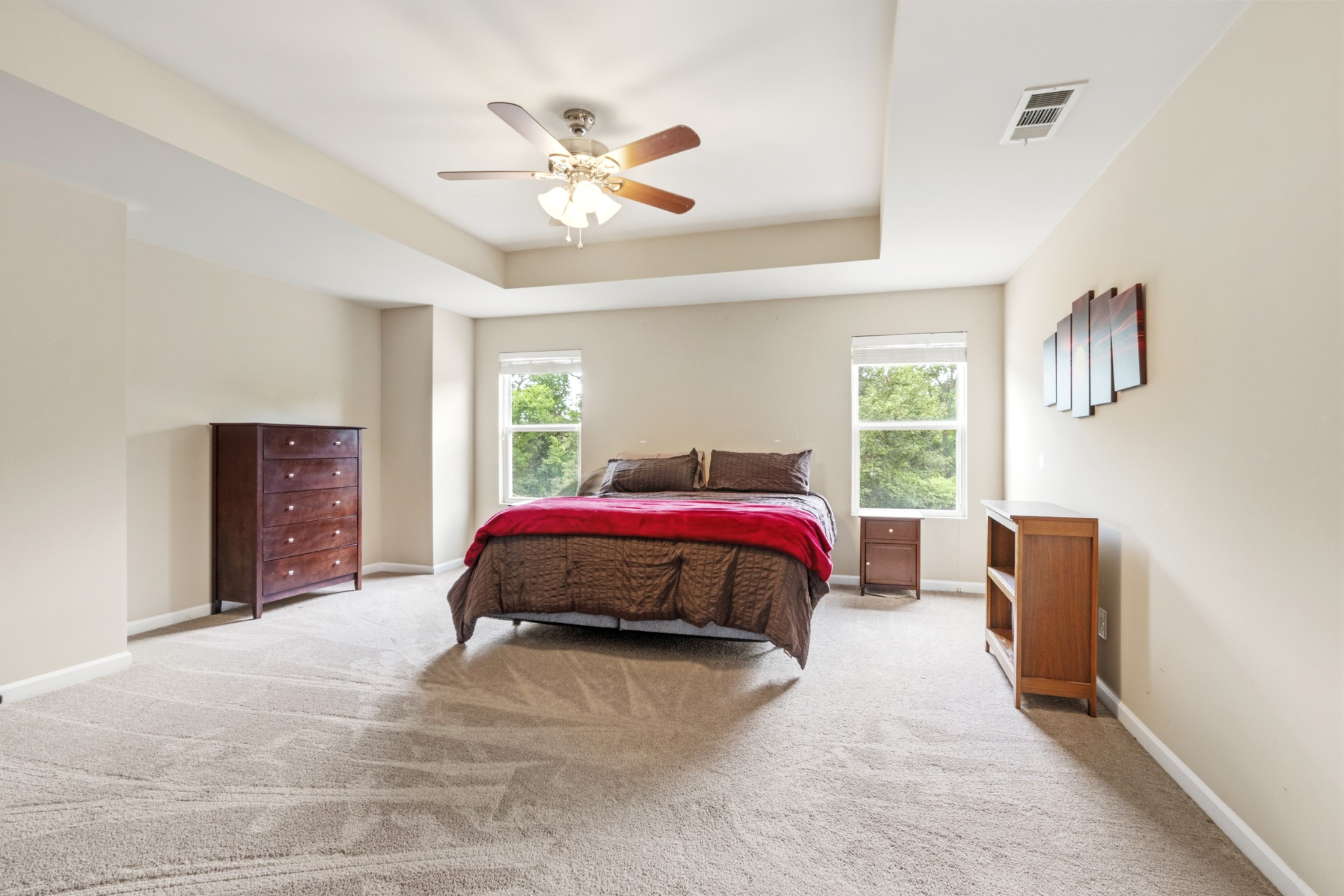 1011 Benwick Road Hendersonville, TN 37075 - Photo 26 of 60 a spacious bedroom with a bed and a chandelier