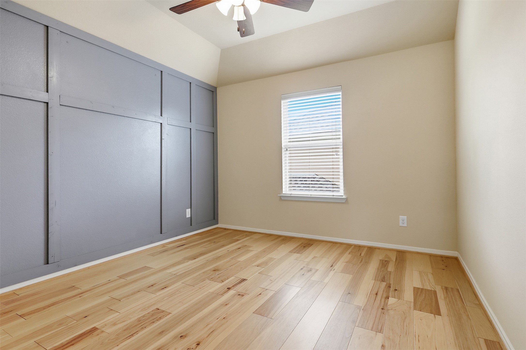 22943 Dale River Road Tomball, TX 77375 - Photo 20 of 29 an empty room with wooden floor cabinet and windows