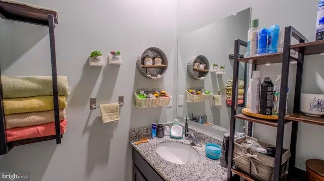 a bathroom with sink and mirror