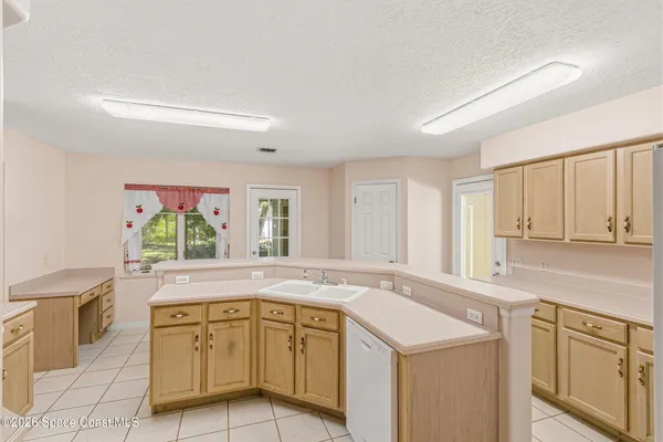 a dining room with furniture and a garden view