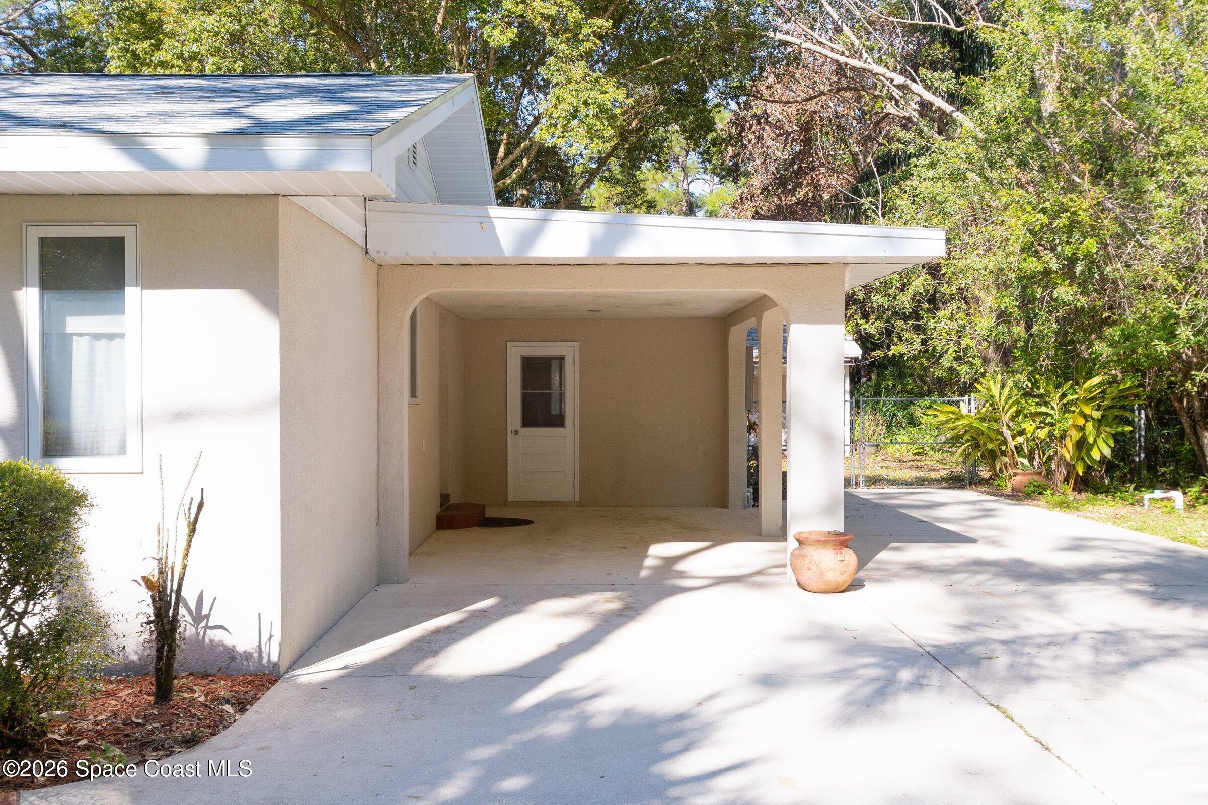 693 West Pine Road Melbourne Village, FL 32904 - Photo 4 of 65 06-693-W-Pine-Carport