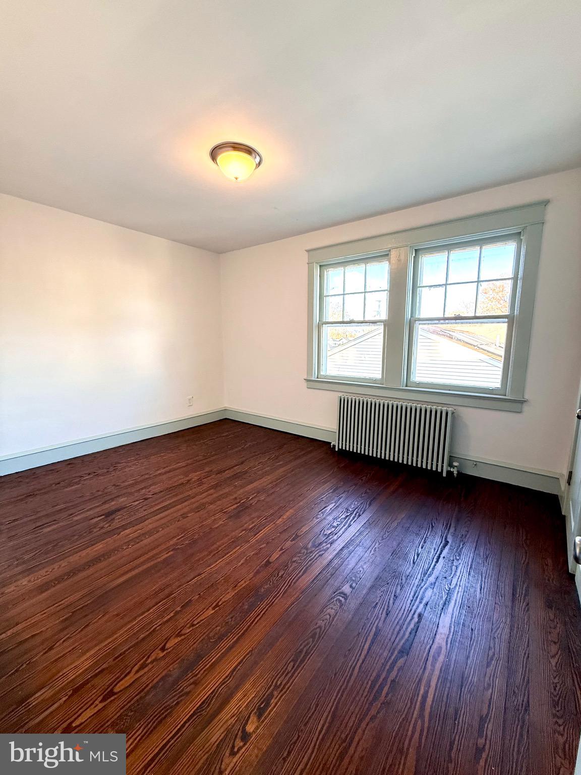 109-111 State Street Penns Grove, NJ 08069 - Photo 15 of 20 an empty room with wooden floor and windows