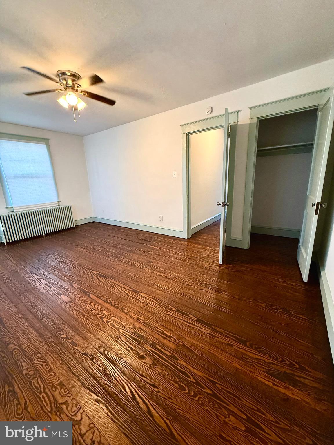 109-111 State Street Penns Grove, NJ 08069 - Photo 18 of 20 wooden floor in an empty room with a window