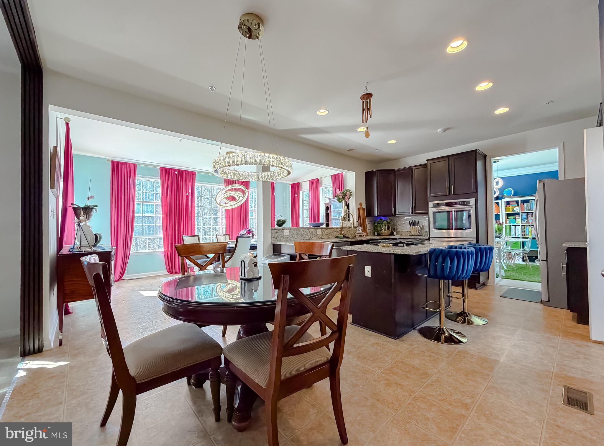 2810 Pumpkin Street Clinton, MD 20735 - Photo 12 of 27 a view of a dining room with furniture and chandelier