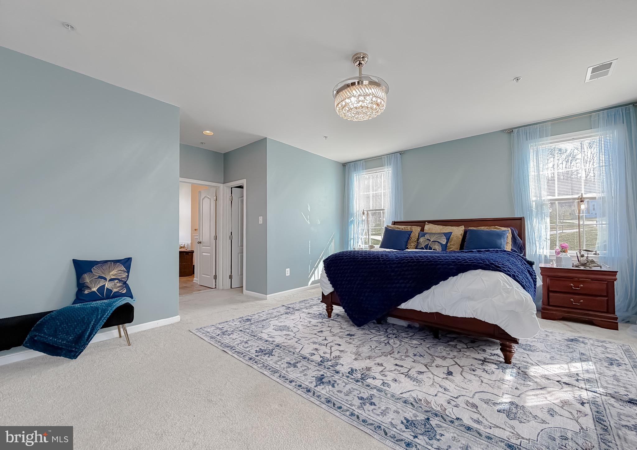 2810 Pumpkin Street Clinton, MD 20735 - Photo 13 of 27 a bedroom with a large bed and a window