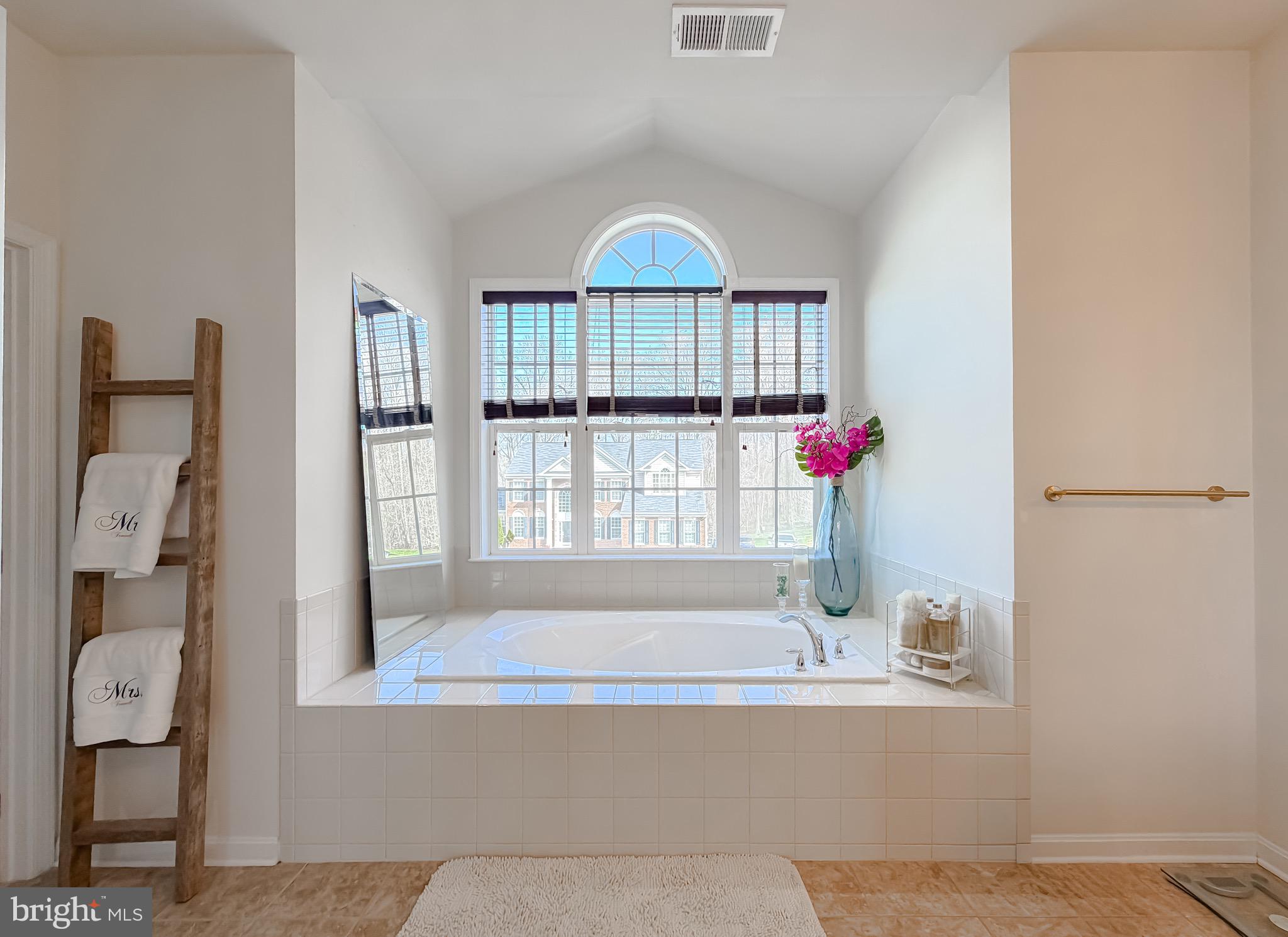 2810 Pumpkin Street Clinton, MD 20735 - Photo 16 of 27 a bathroom with a bathtub and a shower