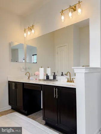 a view of double vanity sink and a mirror