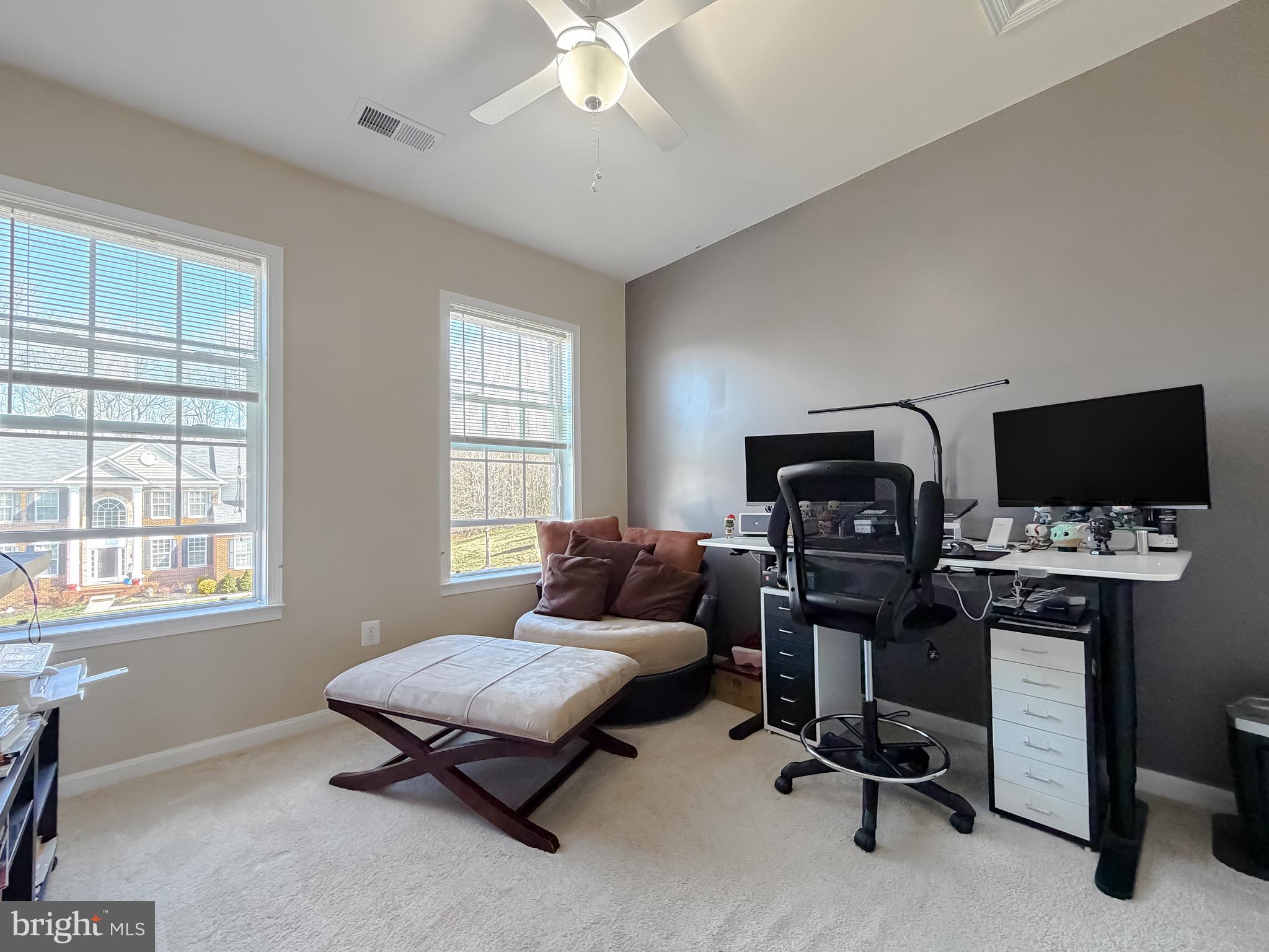 2810 Pumpkin Street Clinton, MD 20735 - Photo 21 of 27 a living room with furniture and a flat screen tv