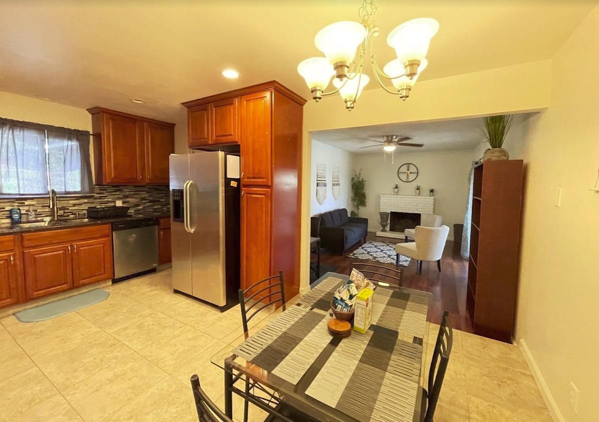 698 West Ashcroft Avenue Clovis, CA 93612 - Photo 6 of 11 a kitchen with sink refrigerator and cabinets