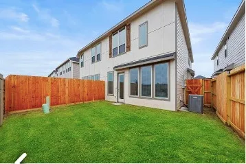 a front view of house with yard and garage