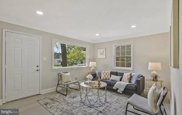 a living room with furniture and windows