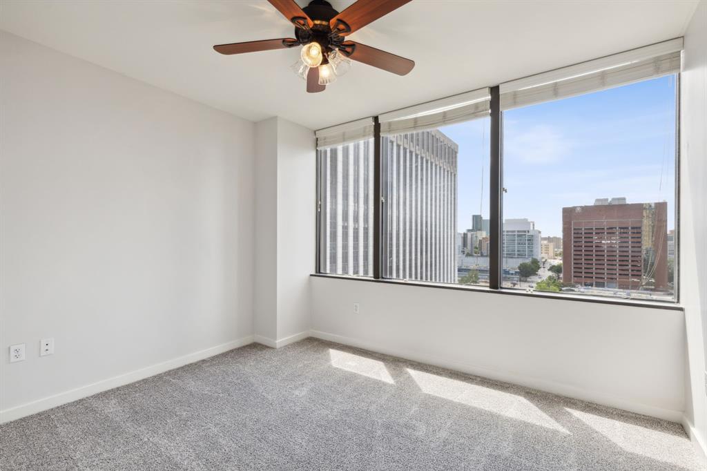 1200 Main Street, Unit 2302 Dallas, TX 75202 - Photo 15 of 22 a view of a livingroom with a ceiling fan and window
