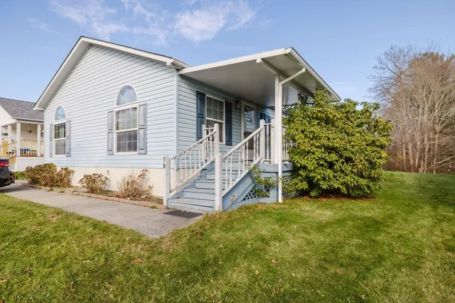 front view of a house with a yard
