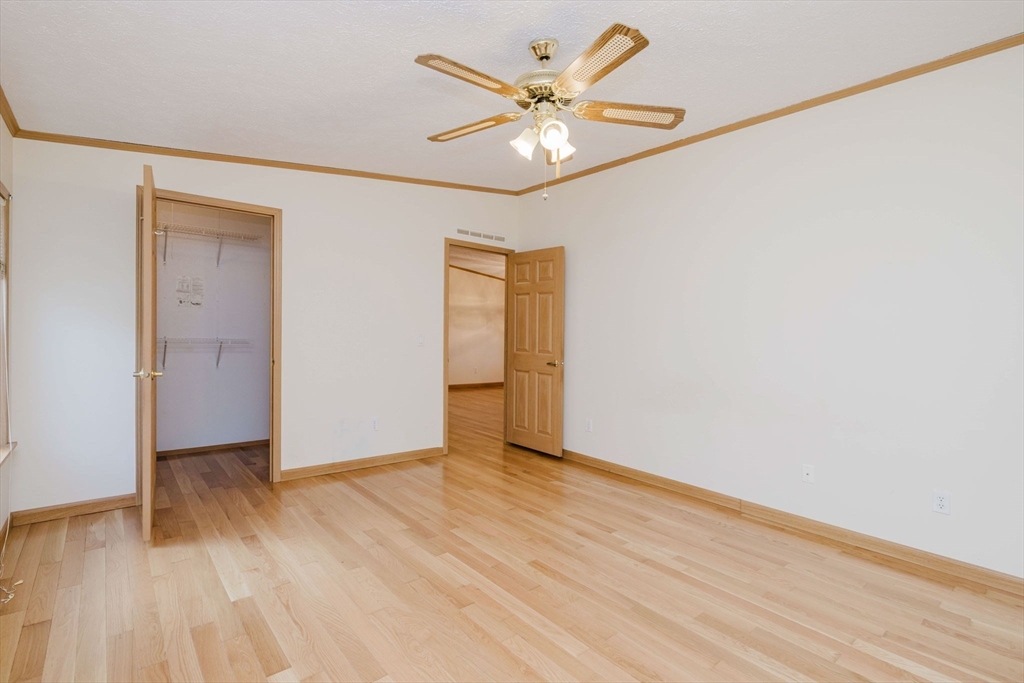 18 Mockingbird Lane Tiverton, RI 02878 - Photo 16 of 32 a view of an empty room with wooden floor