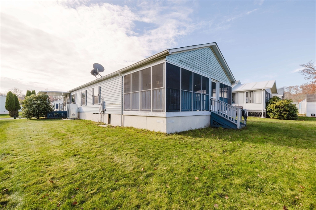 18 Mockingbird Lane Tiverton, RI 02878 - Photo 26 of 32 a view of house with backyard and garden
