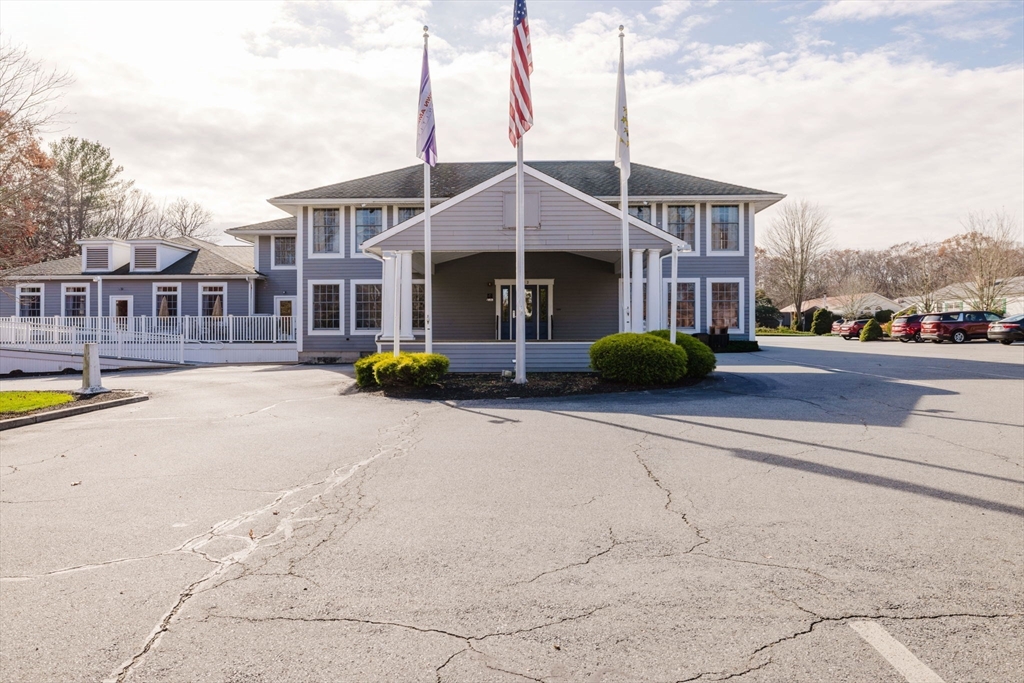 18 Mockingbird Lane Tiverton, RI 02878 - Photo 28 of 32 a front view of a building with street