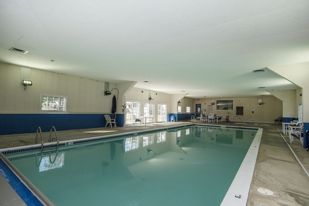 18 Mockingbird Lane Tiverton, RI 02878 - Photo 29 of 32 a view of a swimming pool from a balcony