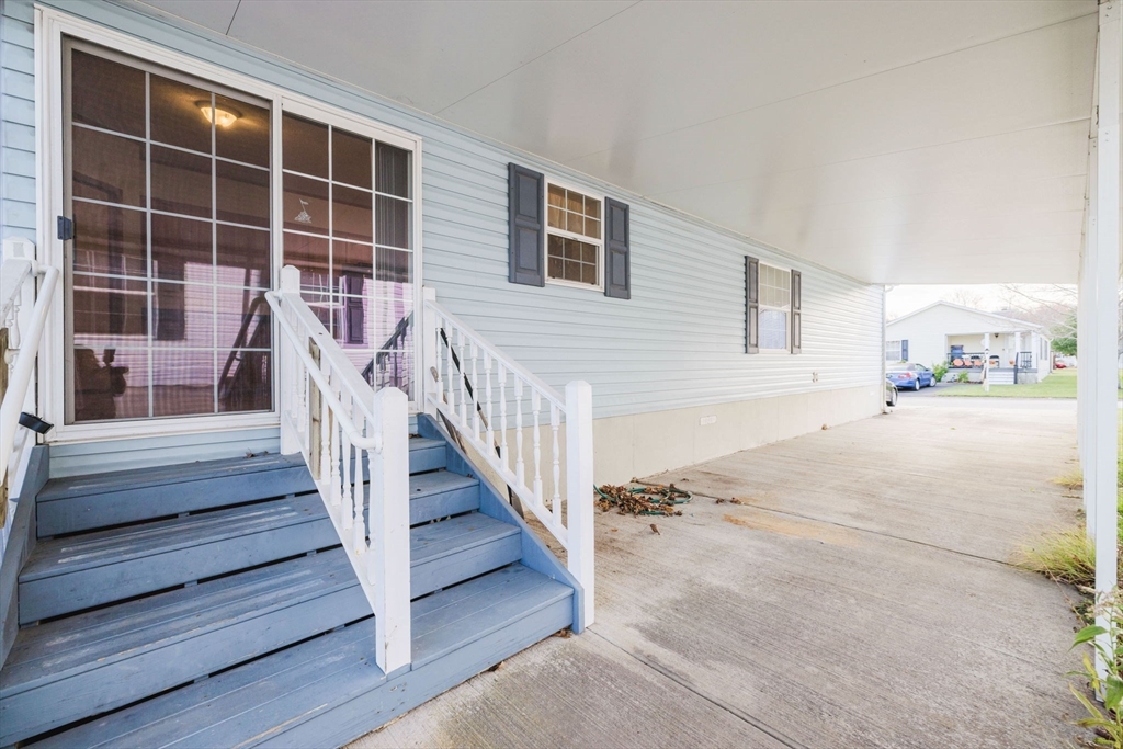 18 Mockingbird Lane Tiverton, RI 02878 - Photo 4 of 32 a view of a house with a lounge chair