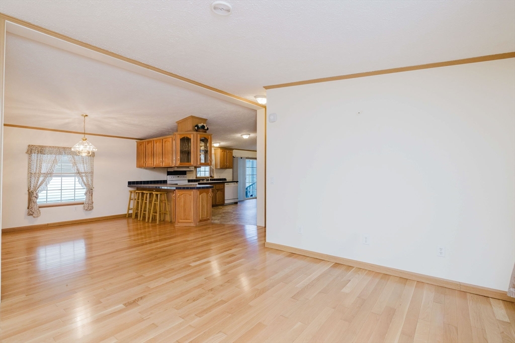 18 Mockingbird Lane Tiverton, RI 02878 - Photo 10 of 32 a view of a kitchen with a sink and a window