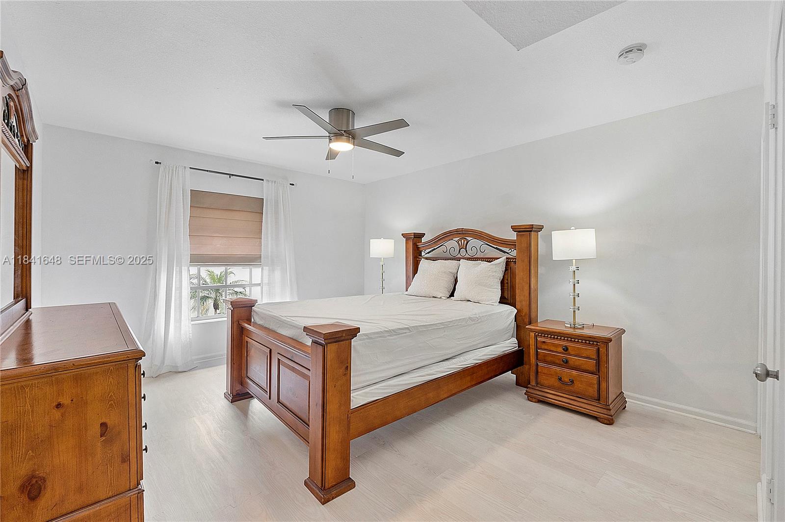 2180 Northeast 67th Street, Unit 728 Fort Lauderdale, FL 33308 - Photo 11 of 49 a bedroom with a bed and a couch