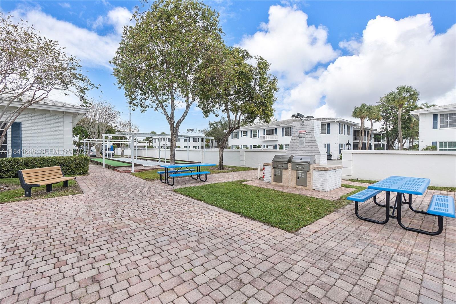 2180 Northeast 67th Street, Unit 728 Fort Lauderdale, FL 33308 - Photo 40 of 49 a view of a house with backyard and sitting area