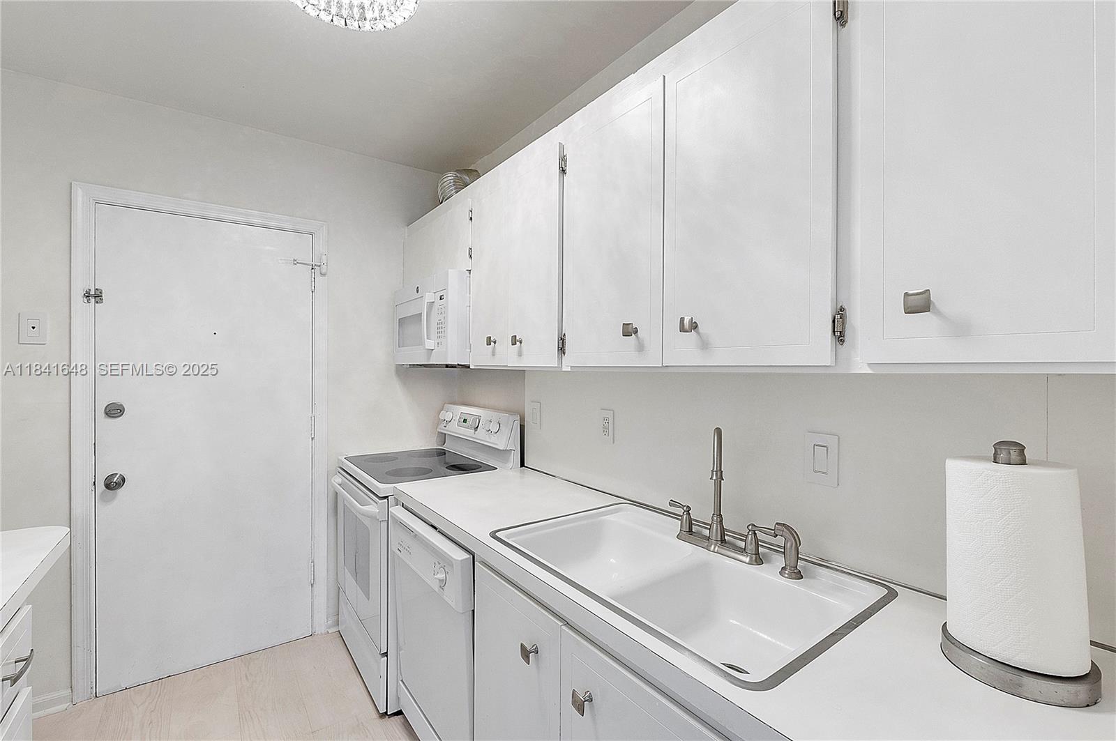 2180 Northeast 67th Street, Unit 728 Fort Lauderdale, FL 33308 - Photo 4 of 49 a view of bathroom with dual sinks