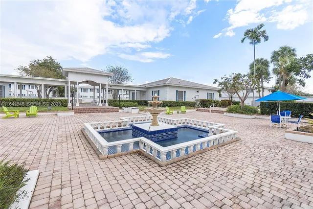 a view of a swimming pool and a patio
