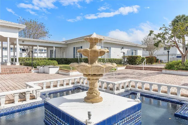 a view of a patio with couches chairs and a table