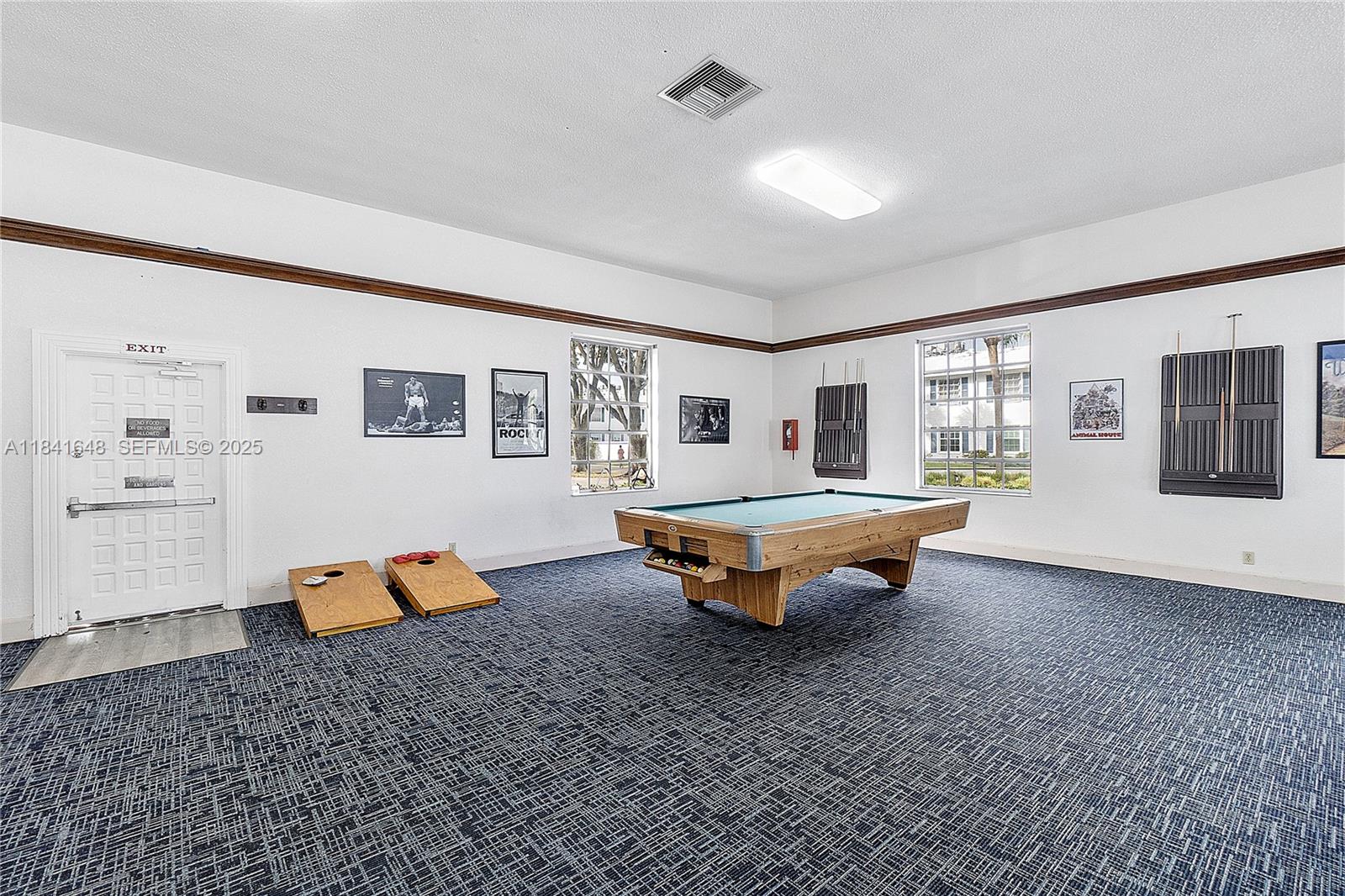 2180 Northeast 67th Street, Unit 728 Fort Lauderdale, FL 33308 - Photo 45 of 49 a living room with furniture and wooden floor